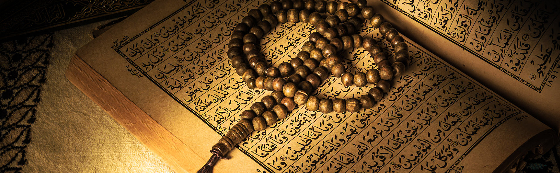 prayer beads on holy book of muslims